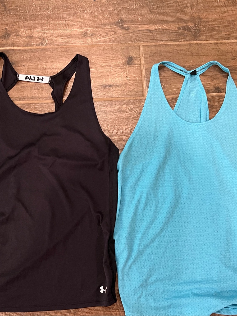 Under Armour Black and Light Blue Women's Racerback Tank Tops. Women’s size L